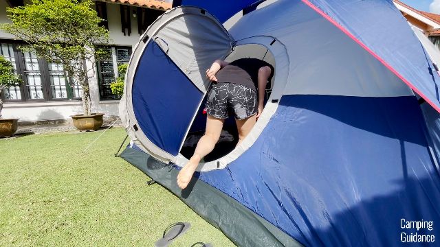 This is a picture of me ducking to get through the hinged door into the Coleman Elite Sundome Tent.