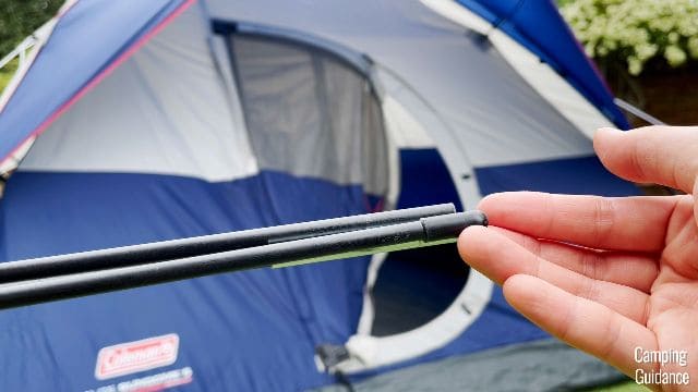 The hinged door poles of the Coleman Elite Sundome Tent have these rounded black tips at both ends of the pole.
