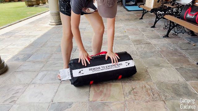 This strip at the bottom of every Coleman bag allows you to expand the bag by removing it.