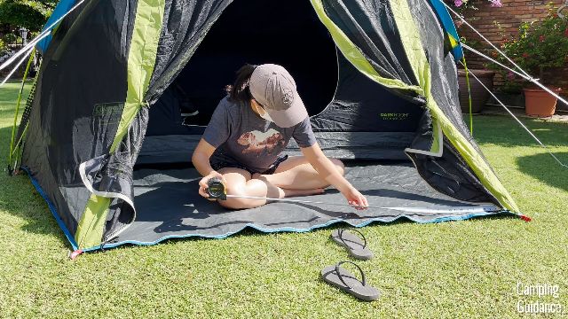 This is a picture of me measuring the shortest length of the Coleman Carlsbad Tent’s screen room.
