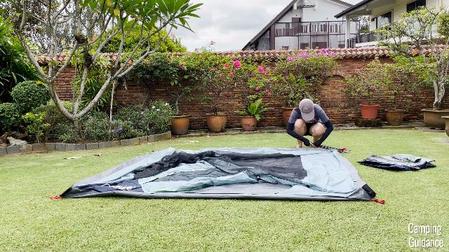This is a picture of the Coleman Skydome Tent flat on the ground in my yard. Where I'm squatting down is where the poles are pre-attached to the tent.