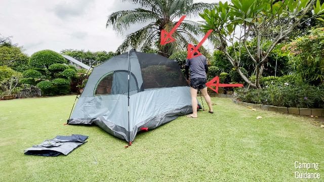 This is a picture of me clipping all the pole clips to the fiberglass poles at the back of the Coleman Skydome Tent.