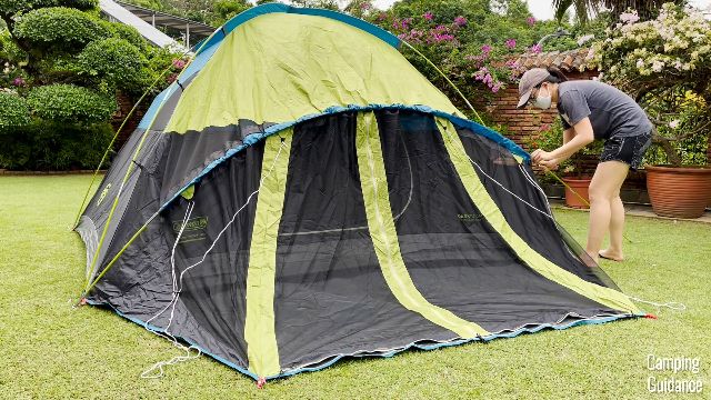 This is a picture of me setting up the screen room of the Coleman Carlsbad Tent.