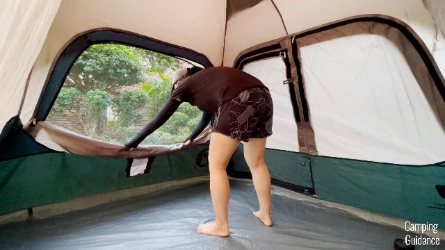 This is a picture of me opening up the windows in the Coleman Instant Tent 4.