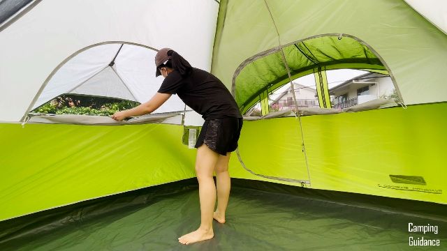 This is a picture of me opening the windows inside the Coleman Evanston 6-Person Tent.