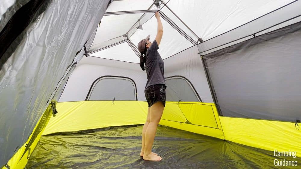 The author standing under the peak height of the Core Instant Cabin 9.