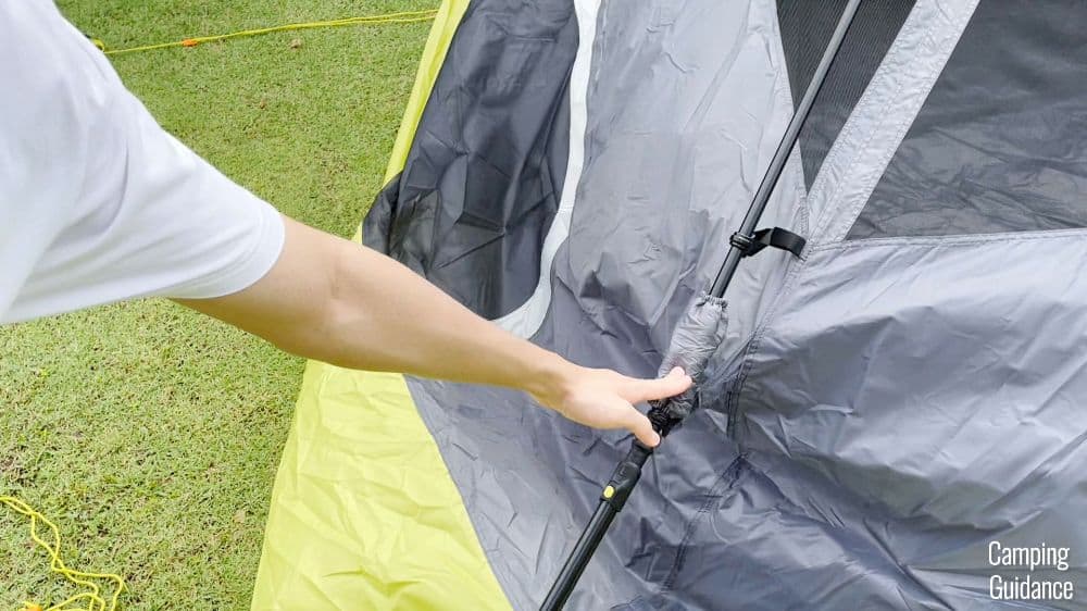The author pushing on one of the elbow joints of the Core Instant Cabin 9