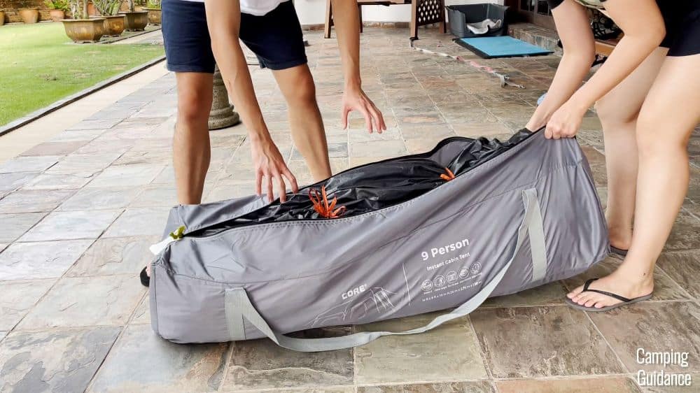 The author and her brother packing away the Core Instant Cabin 9.