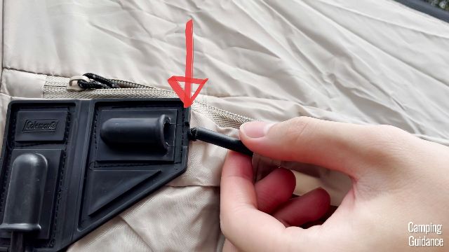 A close up shot of where the black tips dropped out from the hinged door pole.