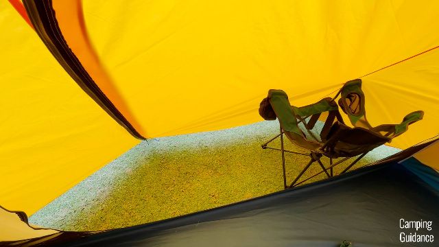 What an REI camping chair looks like inside the back vestibule of the REI Base Camp 6.