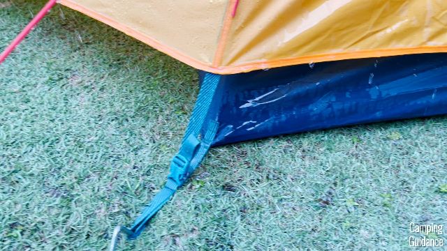 The tent body of the REI Base Camp 6 soaked in water.