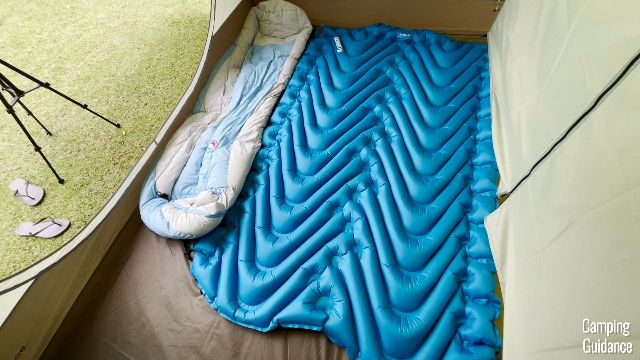 3 pads fit into 1 room of the REI Wonderland 6, when the room divider is up.
