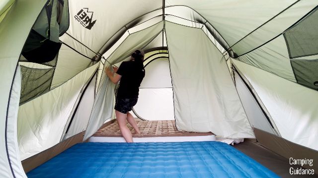 The author zipping up the room divider of the REI Wonderland 6.