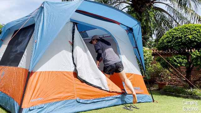 Me getting into the Eureka LX 6 through the door. Notice the bottom zipper track is still zipped up.