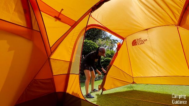 Me tying up the fabric of the vestibule door.