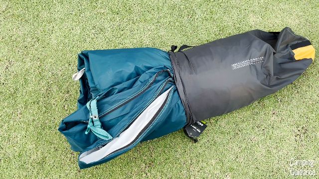 Trying to get the REI Base Camp 6 back into the carry bag.