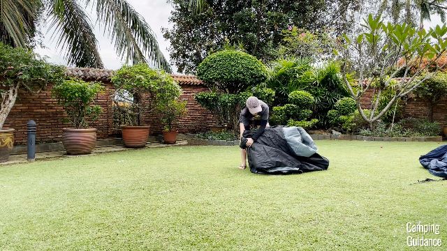 The author compressing air out of the Caddis Rapid 6 instant tent.