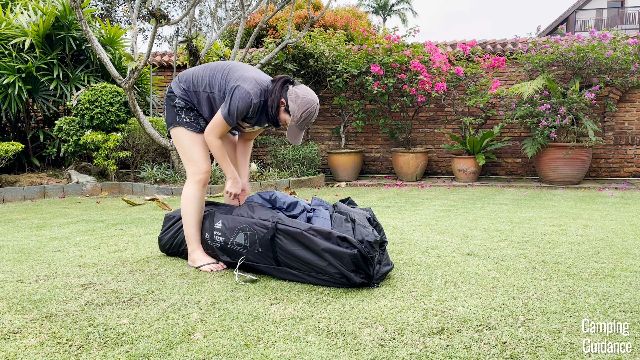 This is a picture of me zipping up the carry bag of the Caddis Rapid 6.