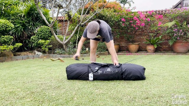 This is a picture of me using a tape measure to measure the length of the Caddis Rapid 6.