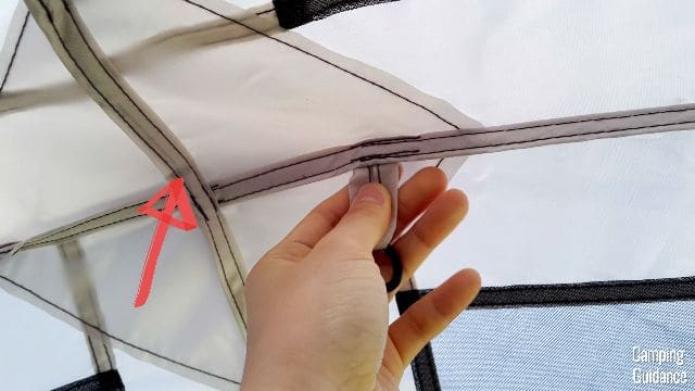 The red arrow is pointing to the fabric that has been reinforced under the center hub.