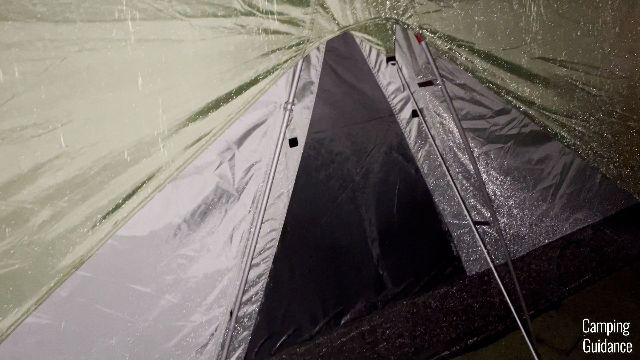 The bottom triangle window of the REI Wonderland 6 is completely drenched.