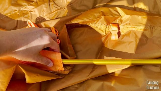 The orange pole of the Wawona 6 goes into the orange pole sleeve.