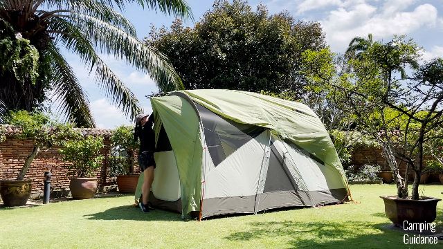 This is a picture of me setting up the rainfly of the REI Wonderland 6 on my own.