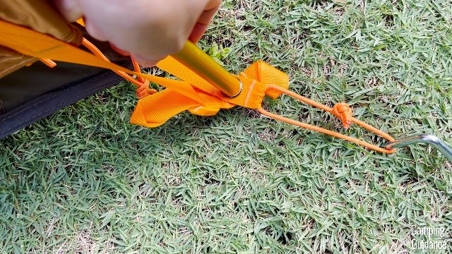 The end of the orange pole goes into the grommet in the orange webbing, and also the grommet of the orange rainfly webbing of the The North Face Wawona 6.
