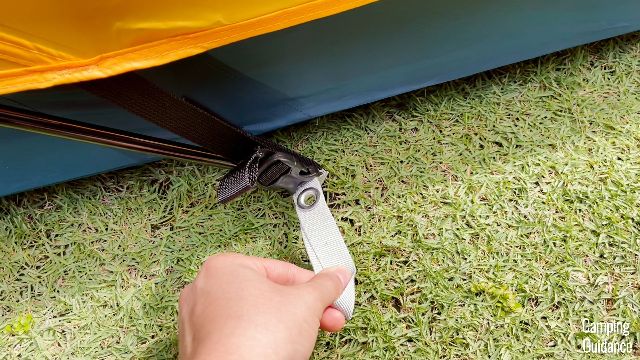 The white rainfly pole is to go into the grommet of the white webbing. There are 4 of these around the tent, even though you only need 2. This is to allow for putting up the rainfly either way you like.