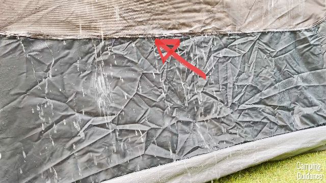 The red arrow is pointing to where the pockets are sewn to the Coleman Instant 4.