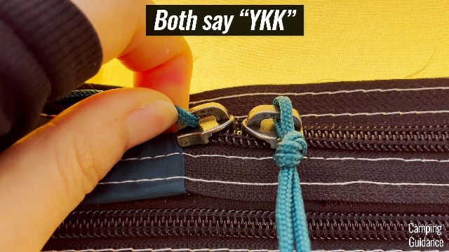 A close-up shot of the YKK door zippers of the REI Base Camp 6.