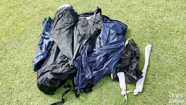 From left to right: Rainfly (blue), tent body with pre-attached poles (black), compression straps (black), gear loft (black), carry bag for stakes (white), carry bag for rainfly pole (also white, but longer).