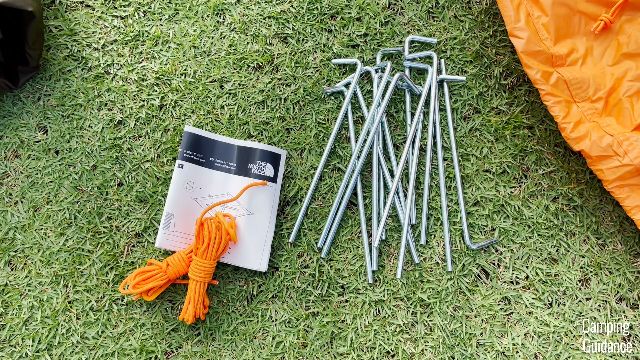 Here are the instructions, un-attached guylines, and metal stakes.