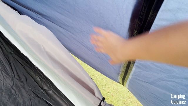 Me running my hand over one of the windows' mesh.