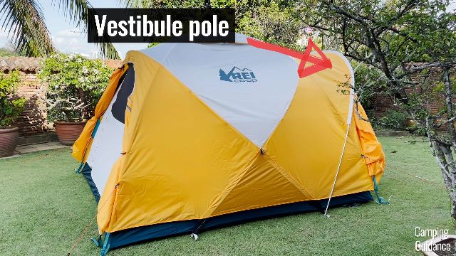 What the REI Base Camp 6 looks like, and the red arrow points to the vestibule pole.