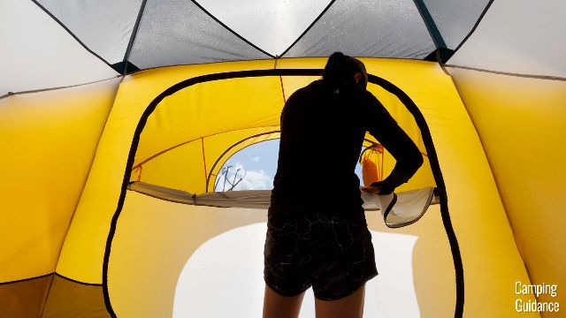 Me opening up one of the windows of the REI Base Camp 6. 