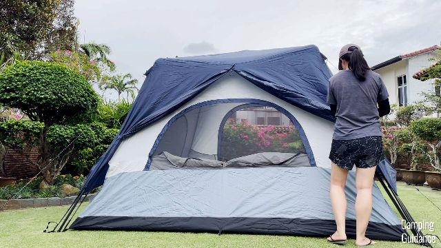 This is a picture of me opening up the rainfly at the back of the Caddis Rapid 6.