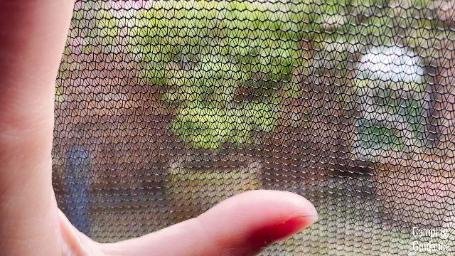A close-up shot of the window mesh in the Ozark Trail Dark Rest Instant Cabin 6