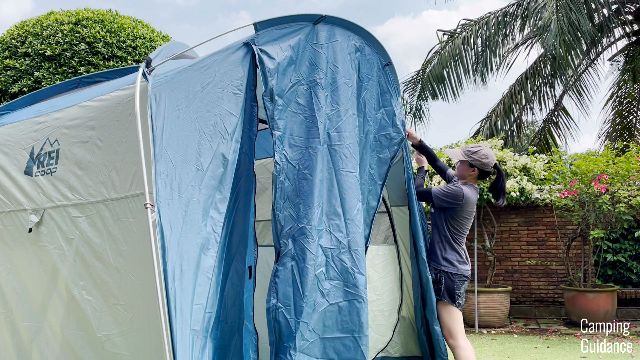The author setting up the awning pole of the REI Skyward 4