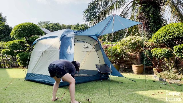 The author setting up the extended awning of the REI Skyward 4