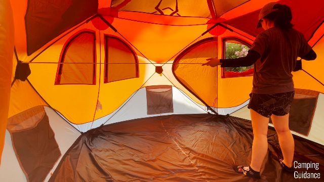 The author measuring the hub-to-hub length of the Gazelle T4 Hub Tent