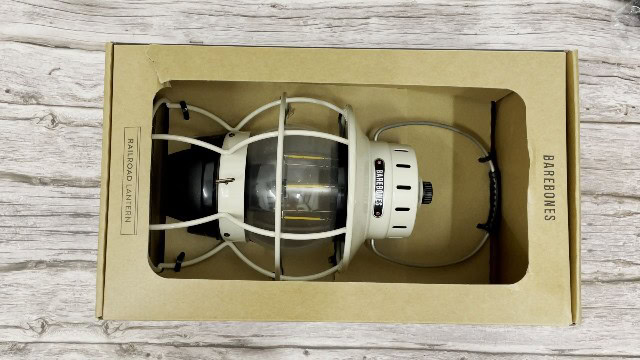 The author unboxing the Barebones Railroad lantern.