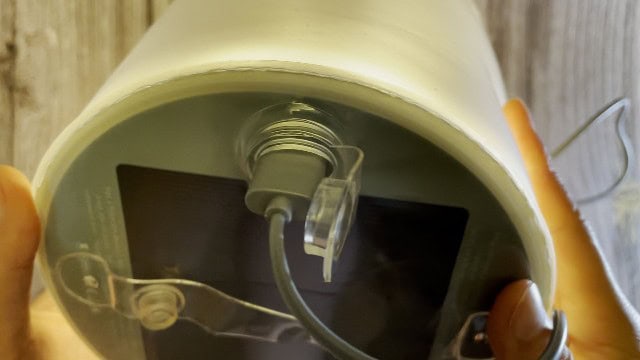 The author charging the BioLite Luci Charge 360 lantern via USB.