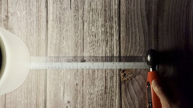 The author testing the lumen output of the BioLite Luci Charge 360 lantern.