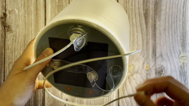 The author using the BioLite Luci Charge 360 lantern to charge her phone.