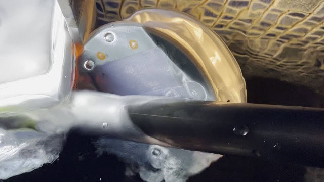 The BioLite Luci Charge 360 lantern submerged in water.