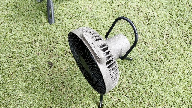 The author rain testing the Claymore Portable Fan V600+.