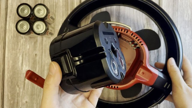 The battery compartment of the Coleman CPX 6 Lighted Tent Fan.