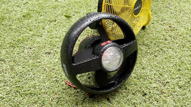 The author rain testing the Coleman CPX 6 Lighted Tent Fan.