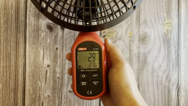 The author measuring the fan speeds of the Coleman OneSource Fan.